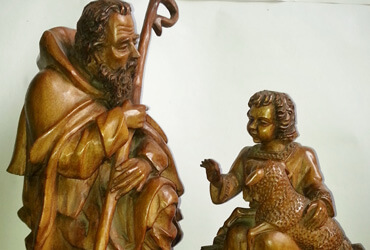 Aurelio Rodríguez - San José conversando con niño. | Dimensiones: 42 cms alto, 48 cms ancho | Tipo de madera: Nogal | Precio: $900.000.-