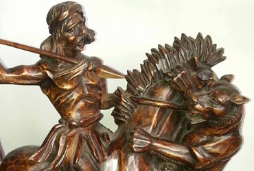 Aurelio Rodríguez - Araucano luchando con puma. | Dimensiones 43 cms alto, 40 cms ancho. | Tipo de madera: Lingue. | Precio $800.000.-